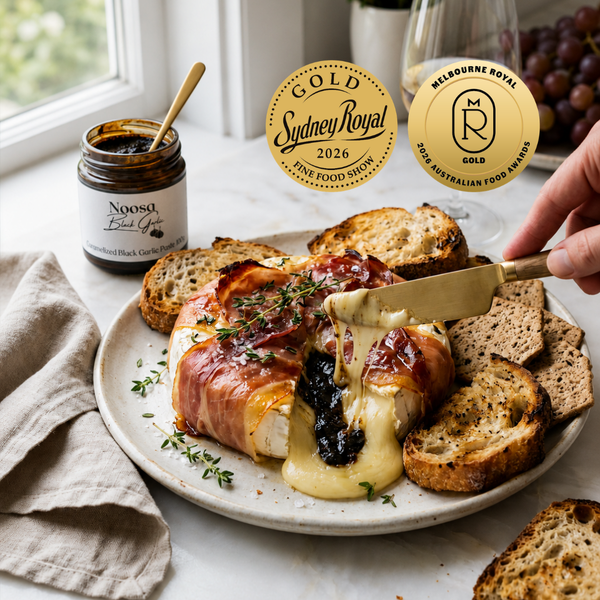 Our top selling, signature product - now a double gold medal winner - Caramelized Black Garlic Paste. Served with baked brie with prosciutto.